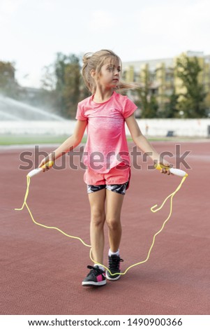 Front view of girl with jumprope Royalty-Free Stock Photo #1490900366