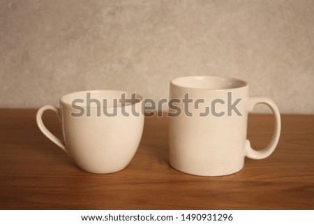 white mug cup on the table