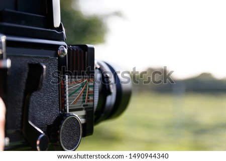 Young Male Photographer using Film Camera
