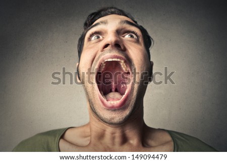 boy screams opening the mouth Royalty-Free Stock Photo #149094479