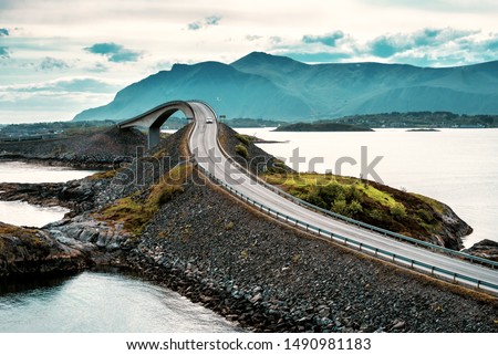 World famous Atlantic road bridge (Atlanterhavsvegen) with an amazing view over the norwegian mountains. Norwegian landscape Royalty-Free Stock Photo #1490981183