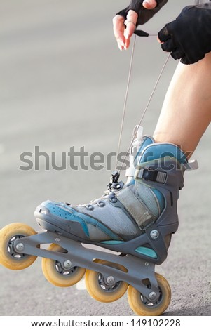 Close-up Of Legs Wearing Roller Skating Shoe, Outdoors 