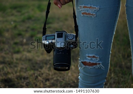 girl with a camera in nature