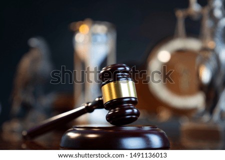 Law symbols composition on vintage table. 