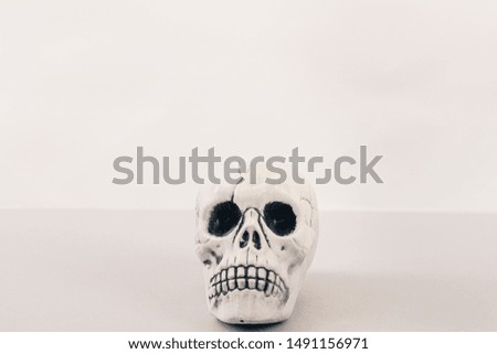 White Halloween skull toy on white background