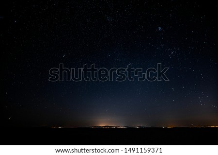 Falling stars. Starry night sky in summer. Away from city lights. 