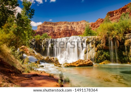 Grand Canyon waterfall inside the desert. Havasupai area and havasu river with blue and crystalline water. 