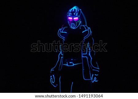 Cyborg on balck background. Led light suit entertainment