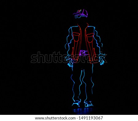 Laser show performance, dancer in suits with LED lamp