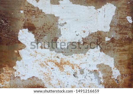 old rusty painted metal wall, rust texture with white paint