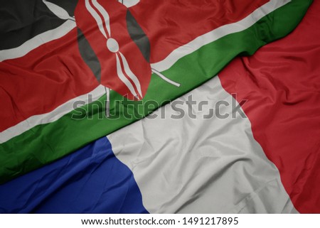 waving colorful flag of france and national flag of kenya. macro