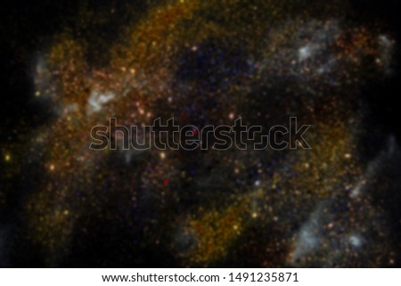 Blurred Gold Glitter Galaxy Background on Black Background