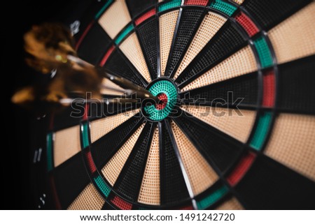 Dart board with darts, sport