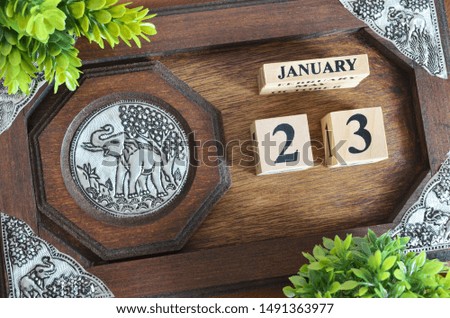 January month with elephant silver wooden design, Date 23.