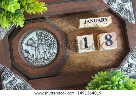 January month with elephant silver wooden design, Date 18.