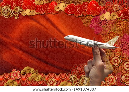 travel concept, miniature airplane in hand