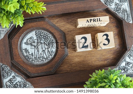 April month with elephant silver wooden design, Date 23.