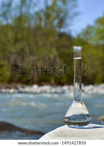 Glass flask with clean drinking water.