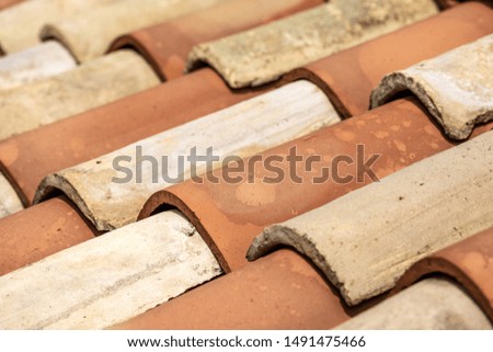 Close-up of an old house roof with a terracotta tiles (clay). Italy, Europe