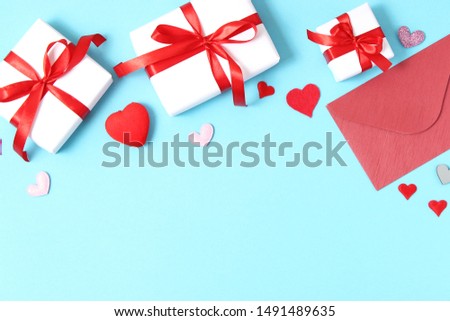 Gifts and hearts on a colored background top view. Love. Valentine's day background with place for text insertion.
