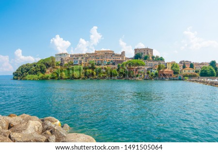 Capodimonte (Italy) - A little old town on Bolsena lake with fortress and suggestive beach and water front; province of Viterbo, Lazio region Royalty-Free Stock Photo #1491505064