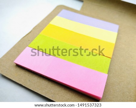 A picture of colourful papers with blur background