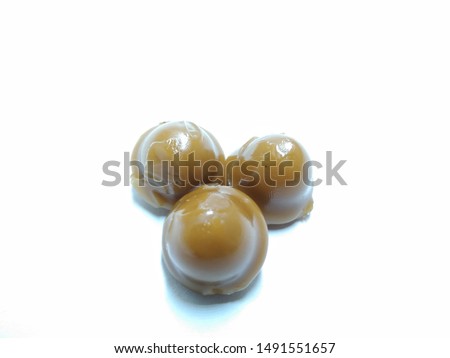 A picture of chocolate flavour candy's on a white background