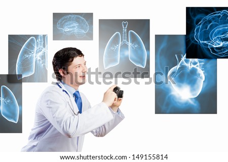 Young funny doctor taking photos with camera