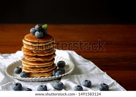 Blueberry Homemade pancake with sweet honey on wood table. horizontal photos