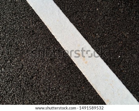 White line paint on road floor for texture abstract