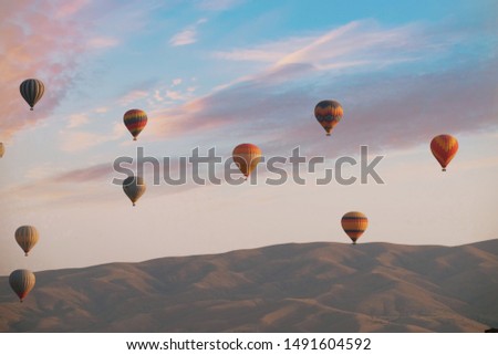 Cappadocia Hot Air balloon with beautiful cloud. Royalty-Free Stock Photo #1491604592