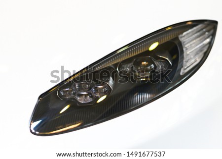 Modern led projector headlight isolated on white background.