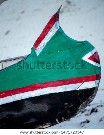 Traditional Vezo fisherman  design on the front of a traditional dugout pirogue on a whithe coral sand beach in south Madagascar near Andavadoaka