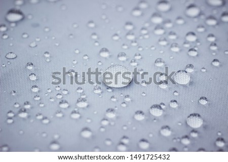 Water drops on water repellent fabric Royalty-Free Stock Photo #1491725432