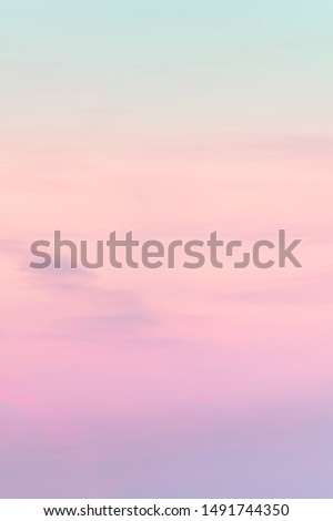 Vertical ratio size of sunset background. sky with soft and blur pastel colored clouds. gradient cloud on the beach resort. nature. sunrise.  peaceful morning. Instagram toned  style