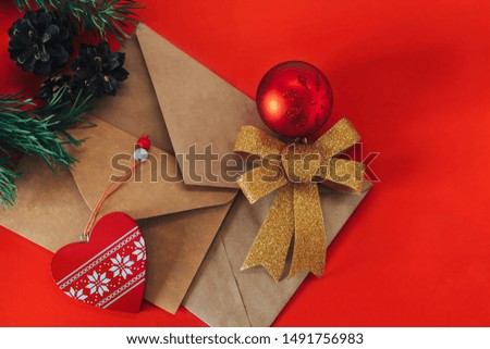 Christmas, New Year card with red background and decorations, top view.