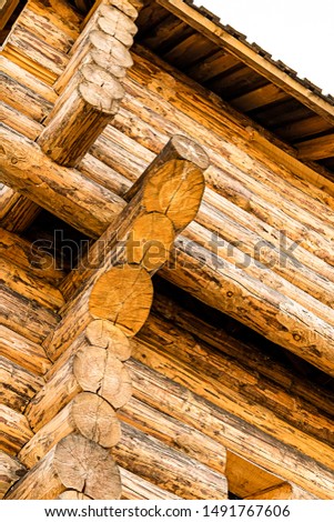 wooden wall of the old fort folded from round logs protection of the city vertical photo
