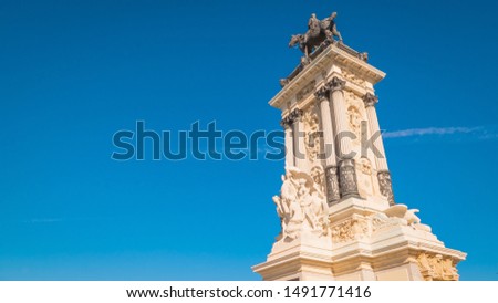 Alfonso XII monument is located in Buen Retiro park by the estanque famous pond with boats in the downtown of Madrid, Spain