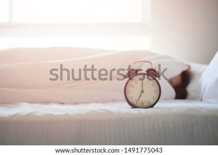 Alarm clock on white background with copy space for you design. Royalty-Free Stock Photo #1491775043