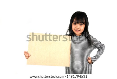 Asian children holding a empty wood board standing on white background ,Education concept. Have copy space for art works