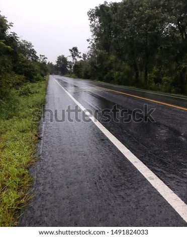 A picture of a roadside with heavy rain