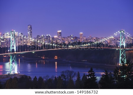 city skyline and Lions Gate Bridge spanning Burrard Inlet Vancouver British Columbia Canada