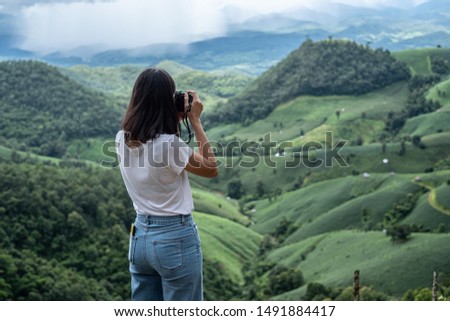 Girls touring and taking pictures of rain forests in northern Thailand