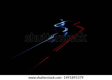 scalextric car around track in the dark