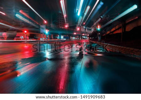  In camera motion blue city lights after the rain urban environment Royalty-Free Stock Photo #1491909683