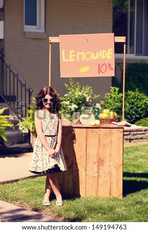 vintage little girl and her lemonade stand