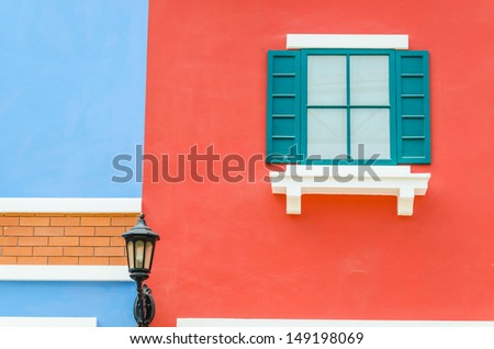 Beautiful window on color wall