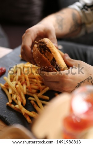 Very delicious hamburger and French fries.