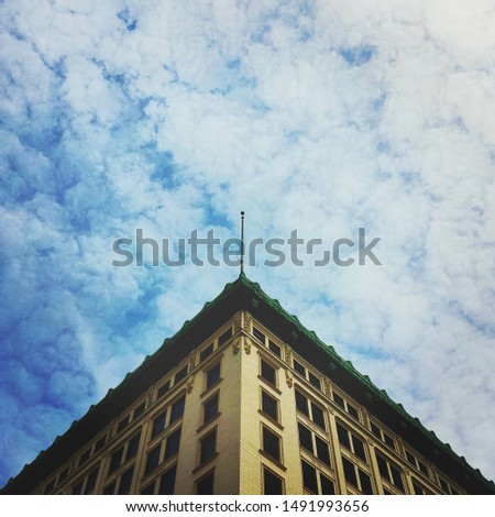 Buildings, architecture, looking up and clouds.