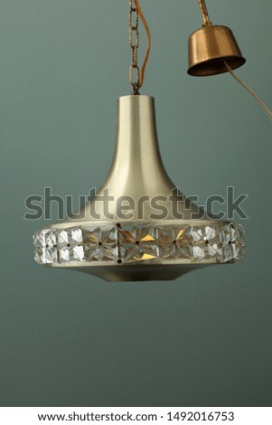 Old Danish hangning lamp, made of sheet metal and a glass lampshade.
Hanging on electric wire.